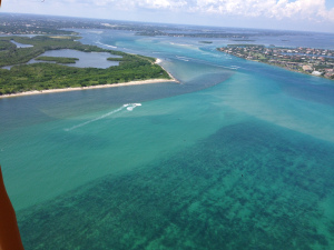 Weak rain plume exiting SL Inlet with near shore reefs in clear view through clear ocean water. 8-24-15. (Ed Lippisch)